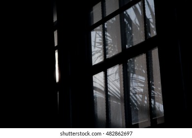 window in dark room, light and shadow