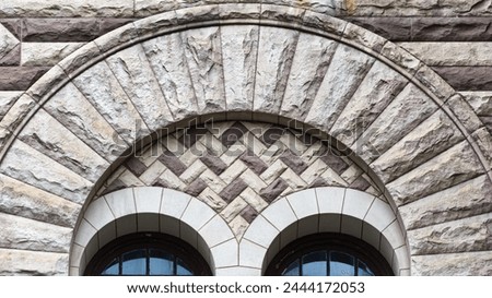 Window decorative arch. Colonial architectural feature or detail in Old City Hall Building (1898), Toronto, Canada