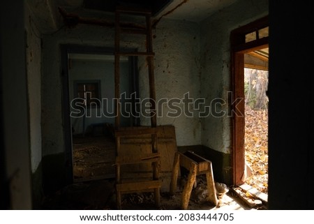 Window in destroyed house. View from the abandoned house. Ukraine.
