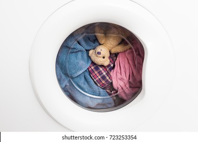 Window Door Of Washing Machine With Laundry And Toy Teddy Bear Inside Who Takes A Look Out (copy Space)/Wild Carousel Ride