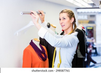 Window Dresser Or Small Business Owner Decorating Shop Display