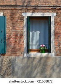 Window facade in Murano, Venice with copyspace on the concrete bottom
