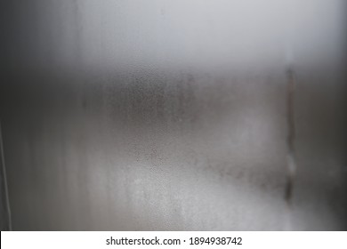 The window was fogged up. Drawing on the wet glass of a window on a gloomy day, isolated at home. Gray color. - Powered by Shutterstock