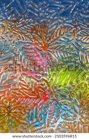 A window glass texture leaf pattern in close up in multicolor