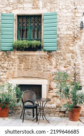 Window With Green Shutters And Table Of The Street Cafe In Sibenik, Croatia.