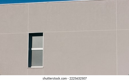 Window in grey facade building
