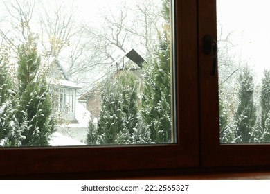 Window Of House With View On Snowy Day