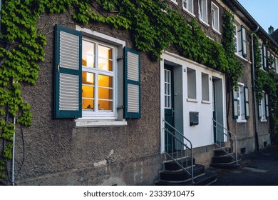 window with ivy around at night in a small historic german street - Powered by Shutterstock