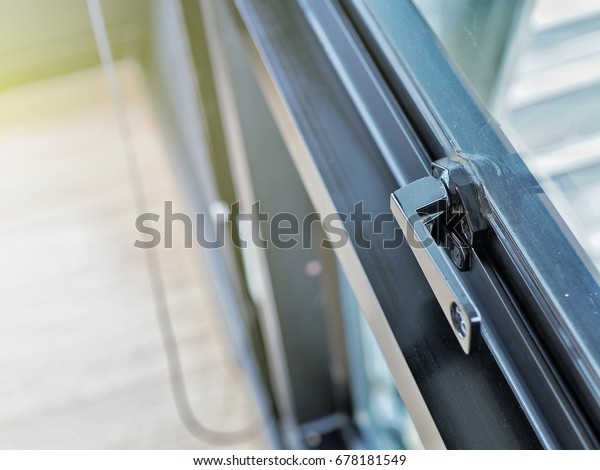 Window latch\
handle, closeup. Lock a\
window.