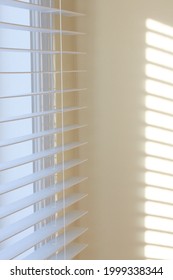 Window Letting Light Through Blinds