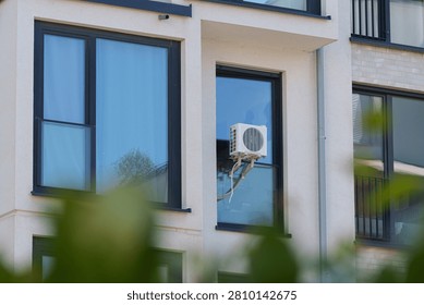 Window mounted air conditioner cools apartment during Europe's summer heatwave