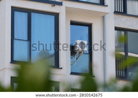 Window mounted air conditioner cools apartment during Europe's summer heatwave