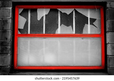 Window On Building With Broken Glass Shattered By Vandalism Destruction