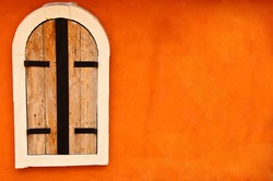 Window On Orange Cement Wall