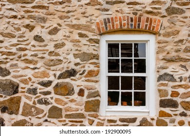 Window On Stone Wall At Old Salem Museum And Gardens.