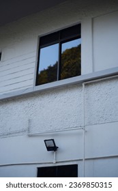 Window on a wall with reflections
