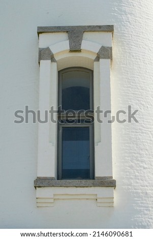 A window on the Yaquina Head Lighthouse