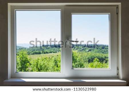  window overlooking mountains.
