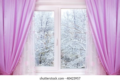 Window With Pink Curtains And Winter View Behind It