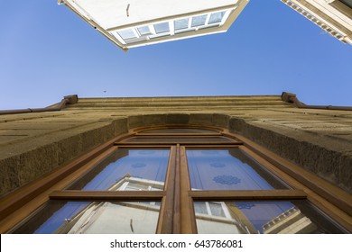Window with reflection in old town
