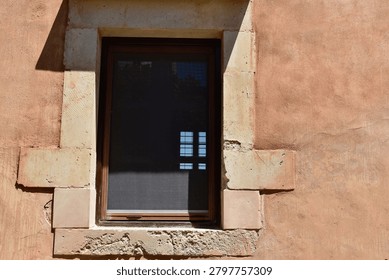 Window reflection

A simple stone-framed window reflects the bright courtyard, highlighting the monastery’s blend of restoration and historic craftsmanship.