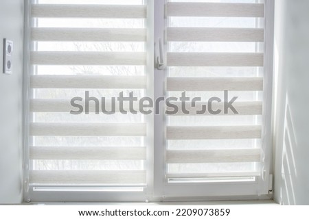 Window roller duo system day and night. Close up on roll curtains indoor