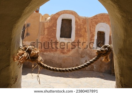 Window and rope in Ksar Hadada. Ksar Hadada served as the filming location for the fictional city of Mos Espa in the movie Star Wars Episode I: The Phantom Menace.