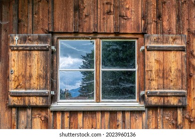 Window Of A Rustic Farmhouse With Wooden Shutters