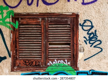 Window with shutter and graffiti
Old window with a shutter in brown color. Wall of the house with graffiti tags. Athens, Greece.