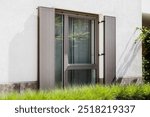 Window Shutter Outdoor. Exterior Panel Window Shutters
Window Hardware. Metal Shutters Blinds of Modern House.