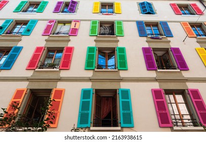 Window shutters of a building in Geneva in rainbow colors as a support to LGBTQ people and organisations.
