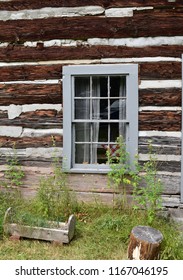 Window in the side of log cabin