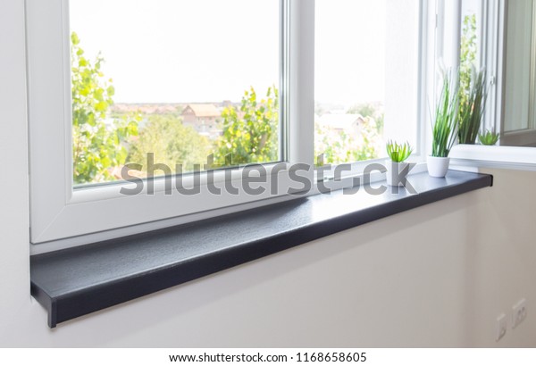 Window sill PVC window in\
living room