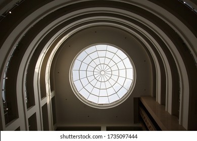 Window to the sky and world. Decorative ceiling. Roof with a figured window of geometric circlr shape. Concept image. Interior Of Modern Building Roof And Windows. 