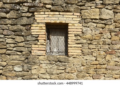 window in stone wall