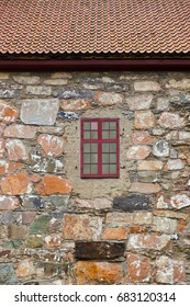 Window in stone wall - architecture background