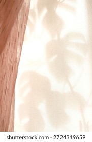 Window and sunset light, moving shadows and tulle curtain on beige pink  background casting floral shadows. Minimal modern interior decoration concept. Autumn wabi sabi style aesthetics