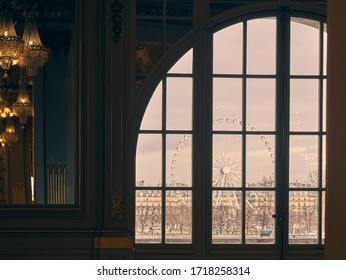window through which you look at a Paris ferris wheel
