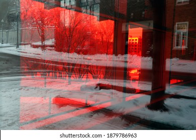 A Window Tinted In Red On A Building