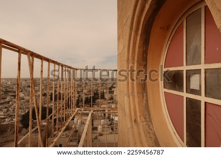 Window and view from the bell tower of the St John the Baptist Church in Madaba, Jordan 2021