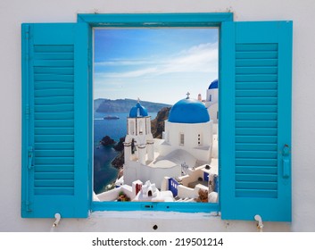 window with view of caldera and classical church with blue domes , Oia, Santorini, Greece