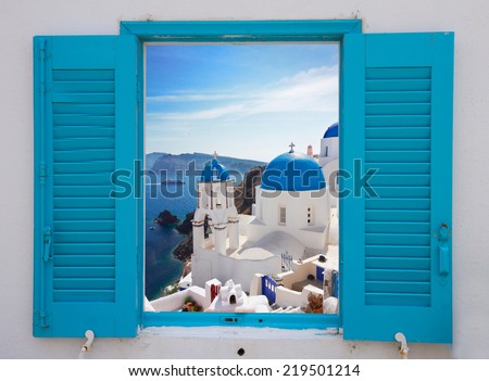 window with view of caldera and classical church with blue domes , Oia, Santorini, Greece