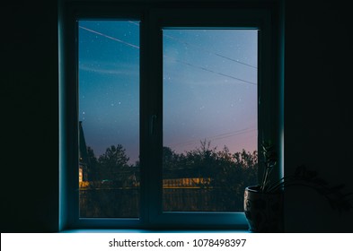 WIndow With View On Night City Sky With Stars And Tree