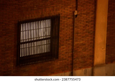 Window in a wall at night