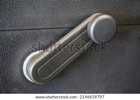 window winder in a car. 
window roller
