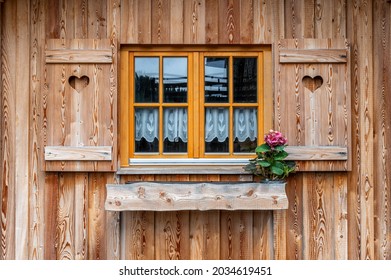 Window With Wooden Shutters On A Rustic Farmhouse