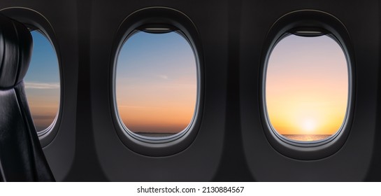 Windows airplane flying on sunset sky in the morning over ocean, Inside Plane Nobody