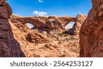 The Windows in Arches National Park, Utah. Also known as the Spectacles, these two arches stand side by side, cut from the same sandstone fin. A large nose separates the Spectacles