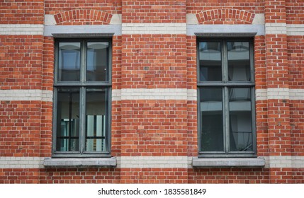 
the windows of a brick building