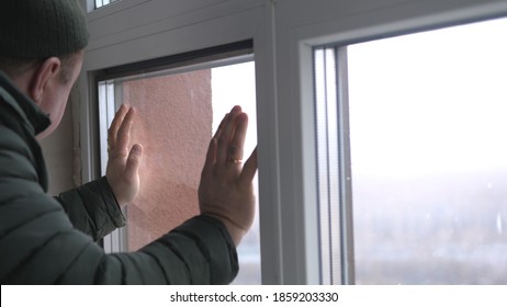 Windows installation worker, construction worker sets of plastic window. Close up of hand